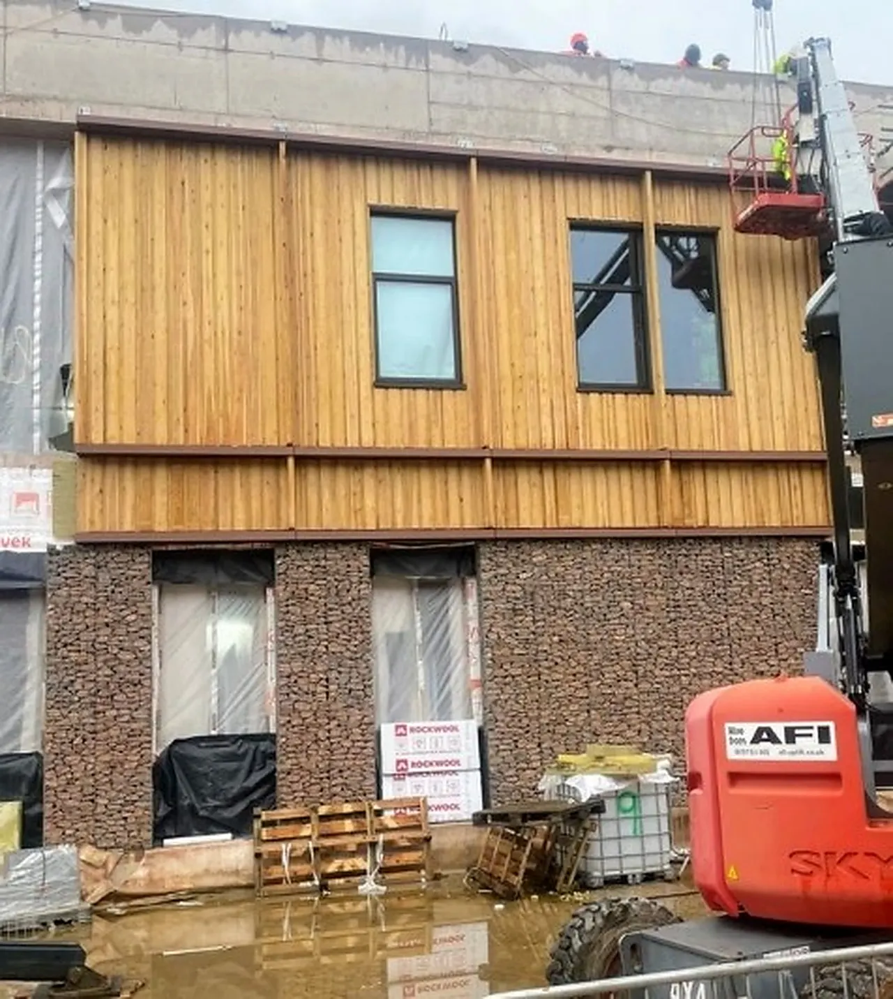 A timber-faced facade module installed on site