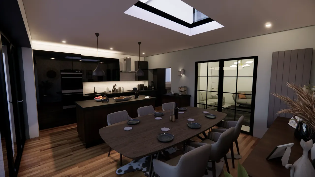 The new kitchen and dining room under a long rooflight, with doors to the garden
