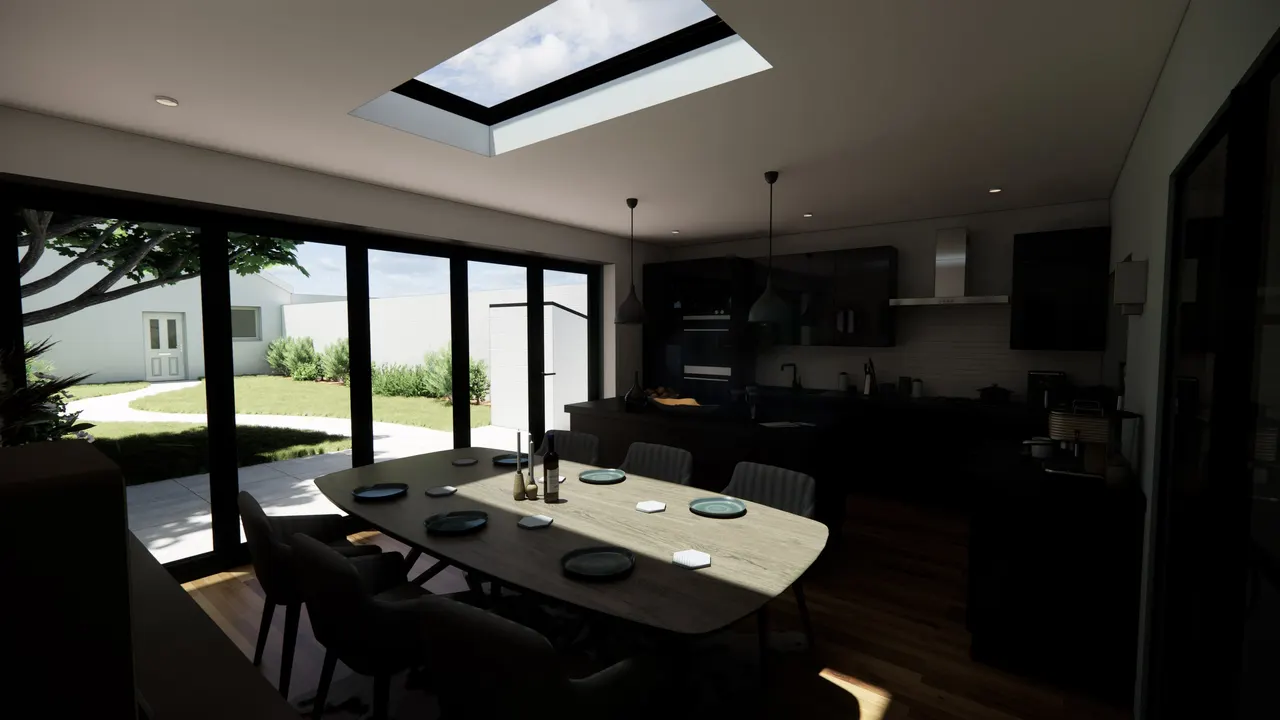 The dining table facing the garden through glazed doors